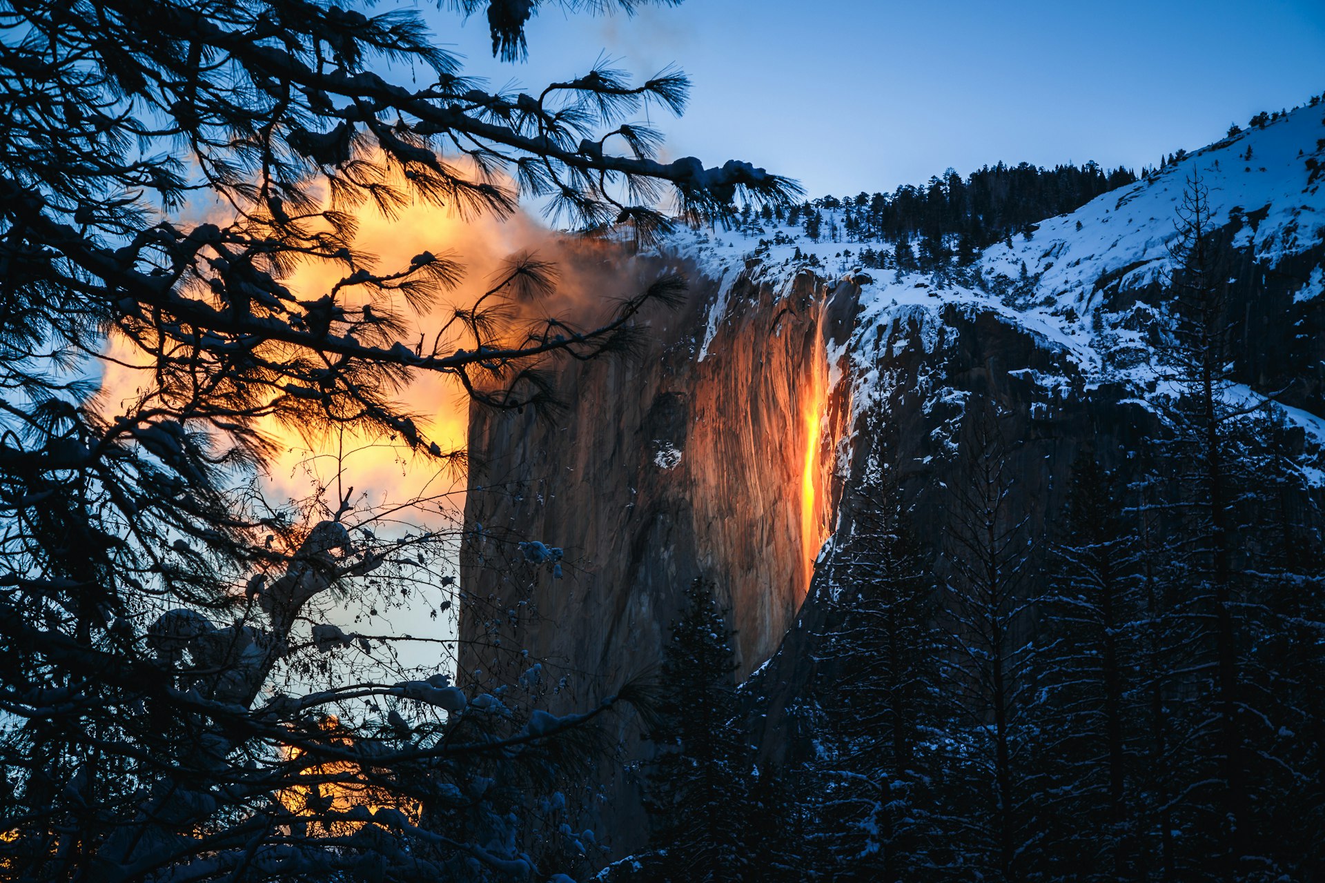 A view of El Capitan mountain in Yosemite shows the "firefall" - a natural phenomenon when a waterfall appears as though it's glowing. 